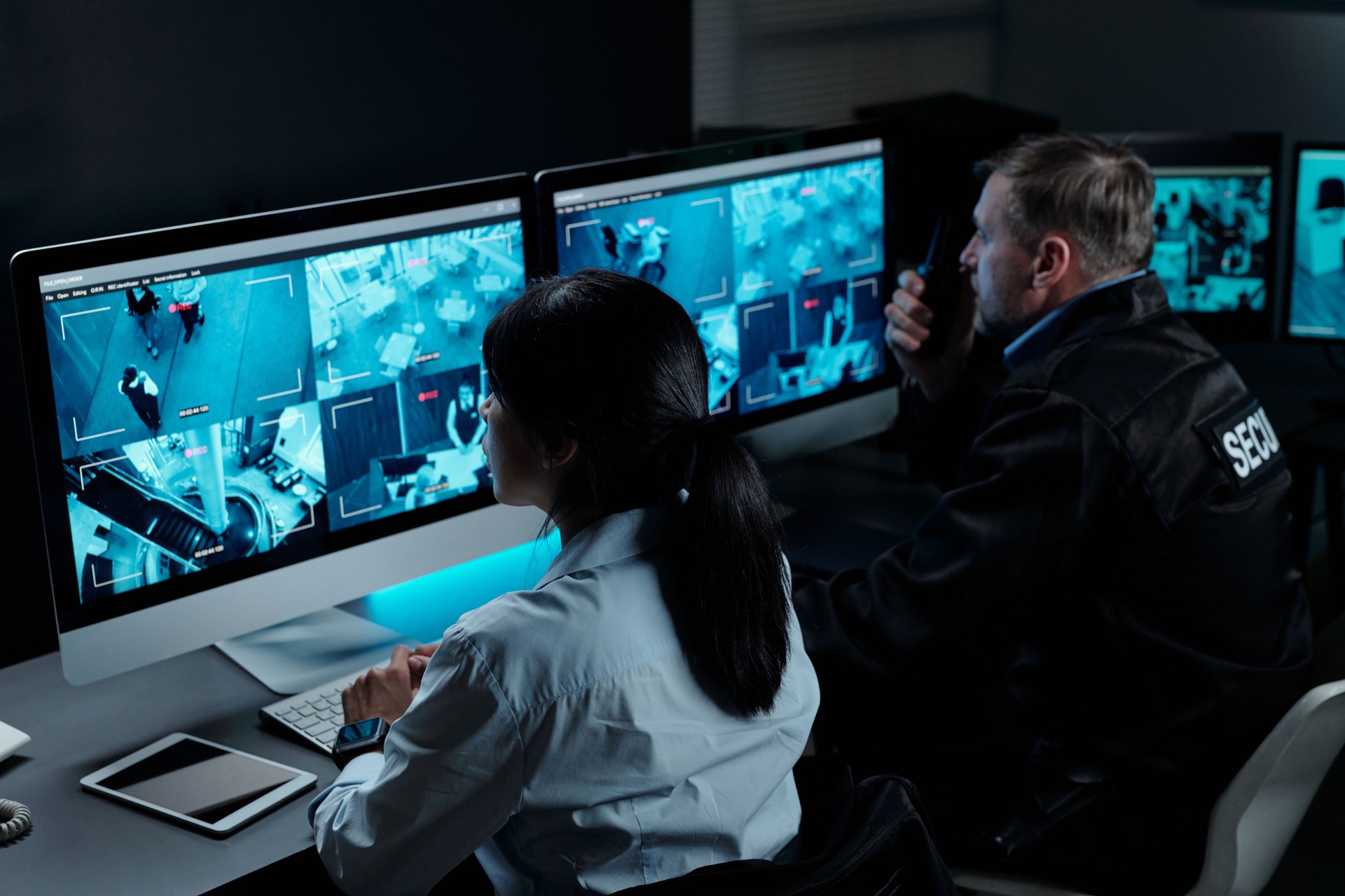 Officers in front of computer monitors